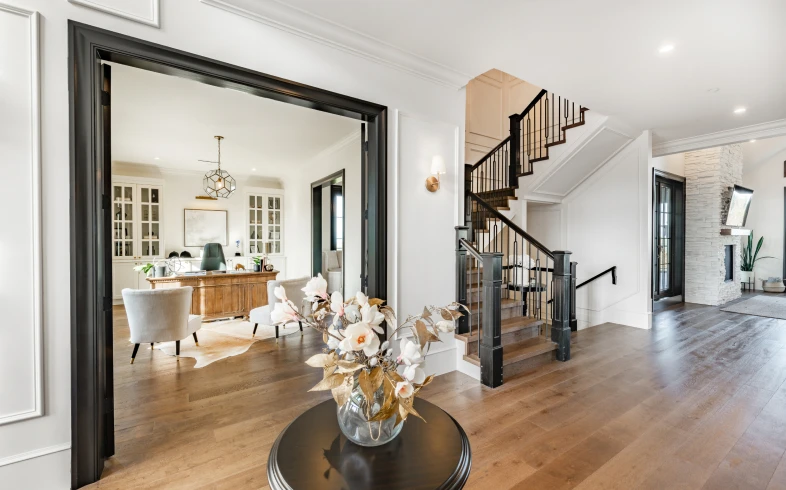 Elegant modern living room with staircase view.